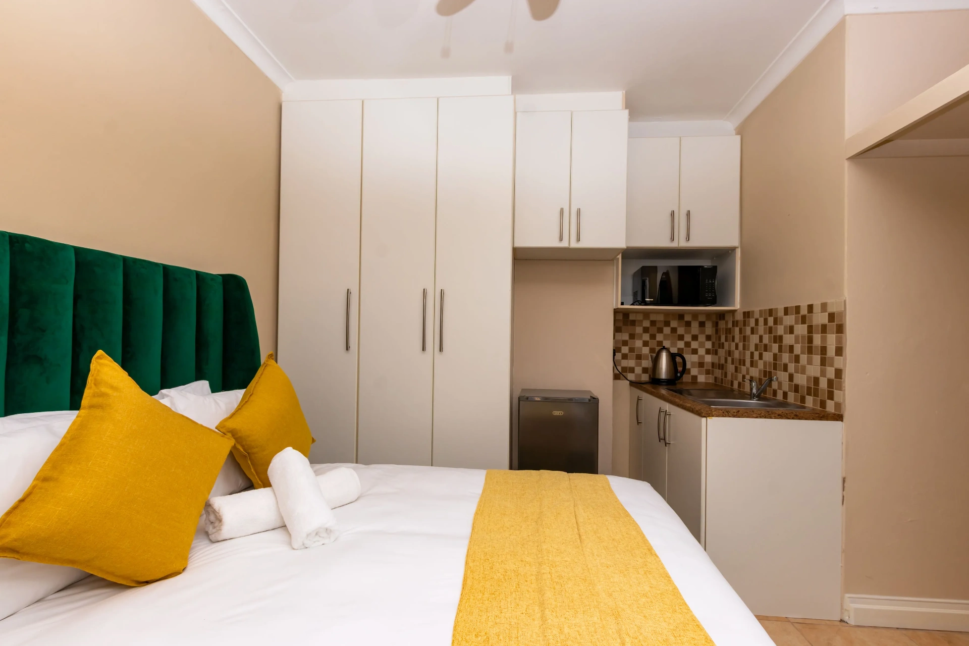 The Aurora Room — wardrobes and kitchenette detail
