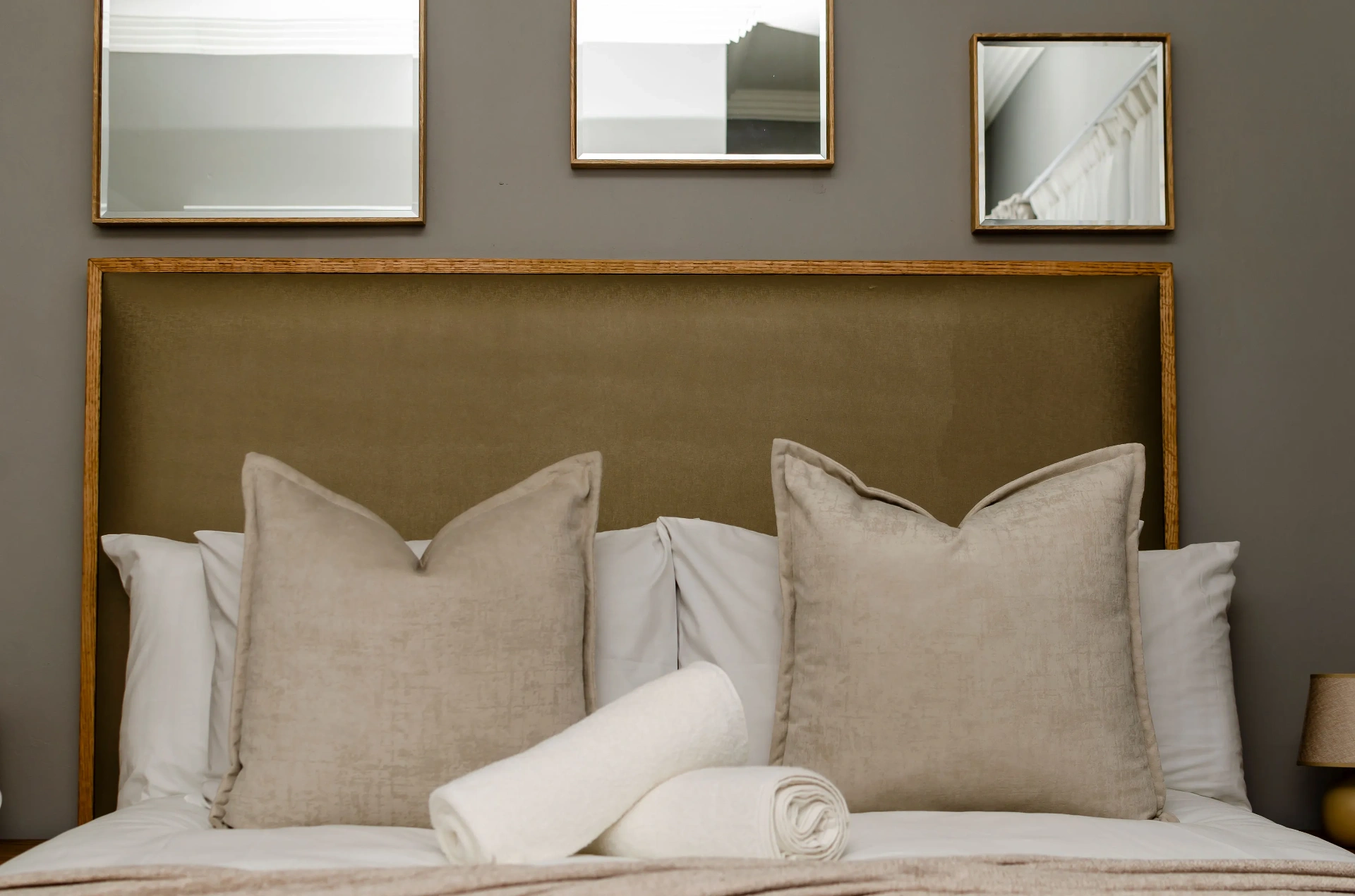 The Horizon Room — gallery wall above the bed