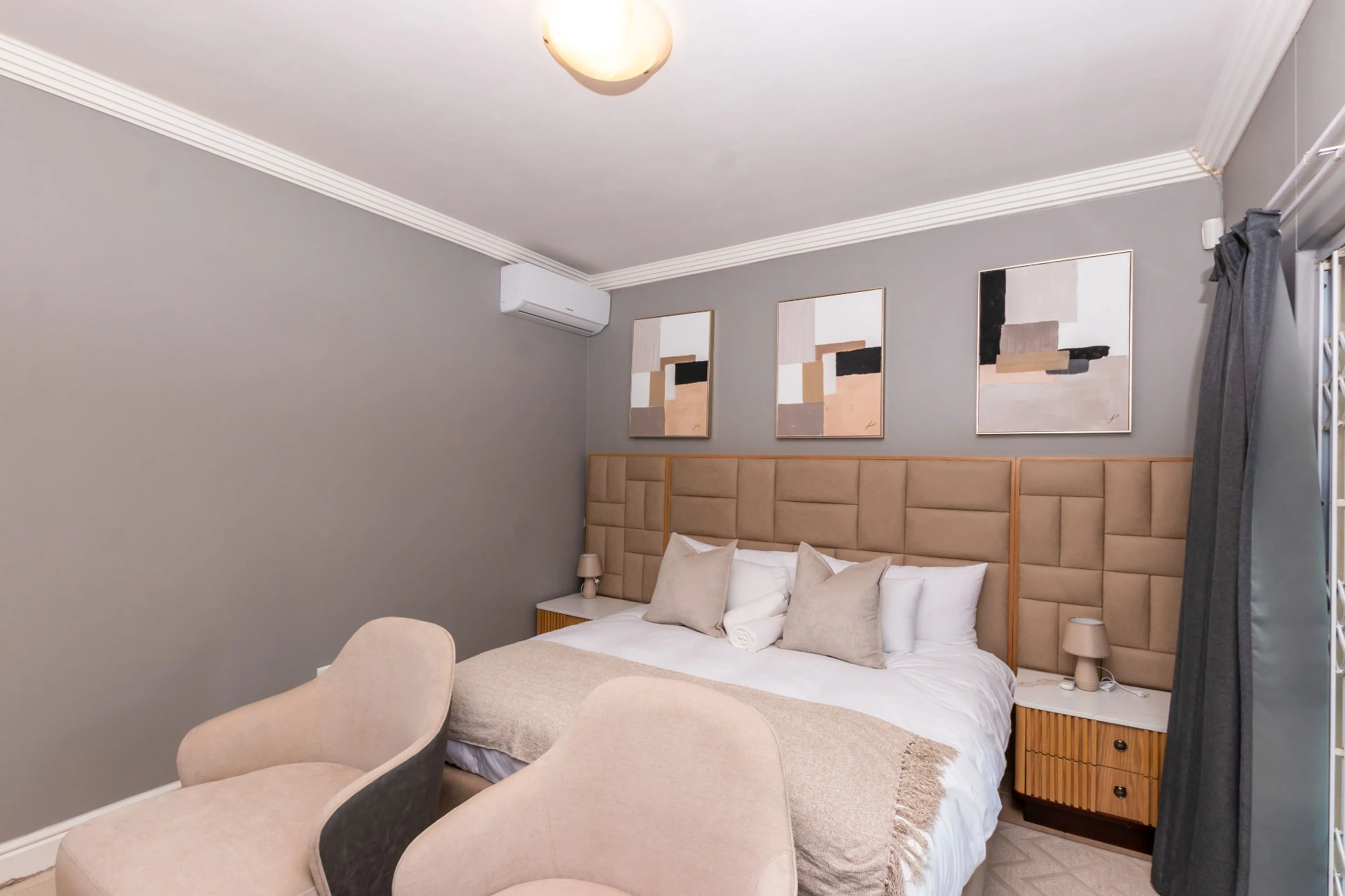 Presidential Suite — bed and curated artwork
