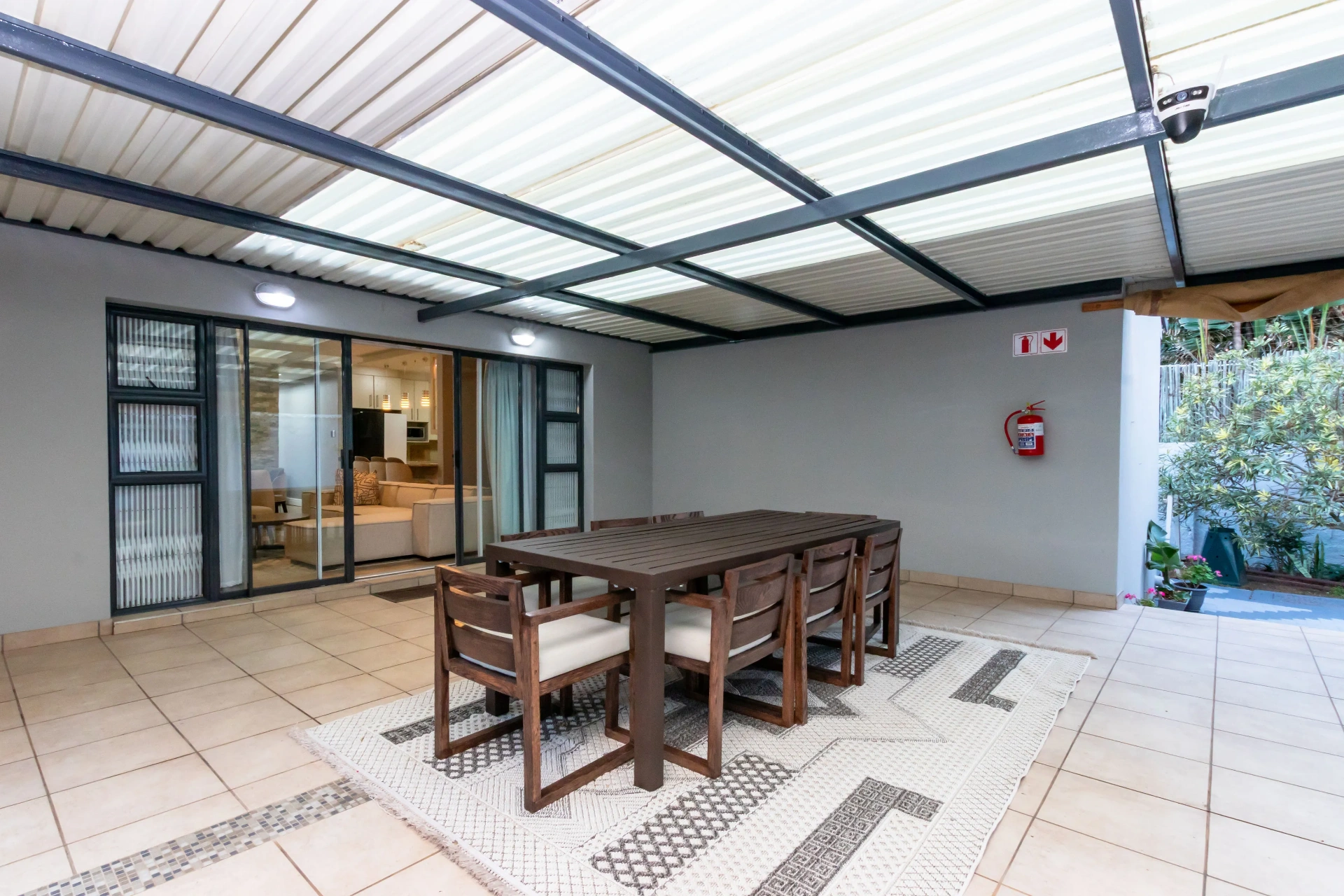 Covered patio with dining for eight