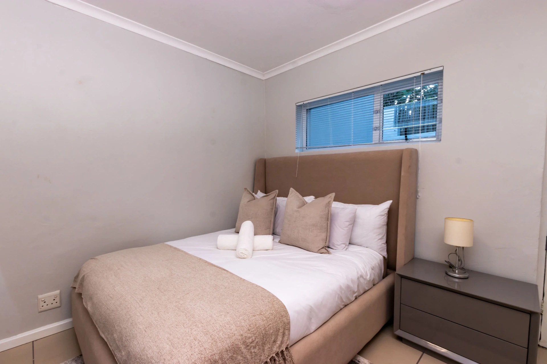 The Signature Room — soft styling and bedside lighting