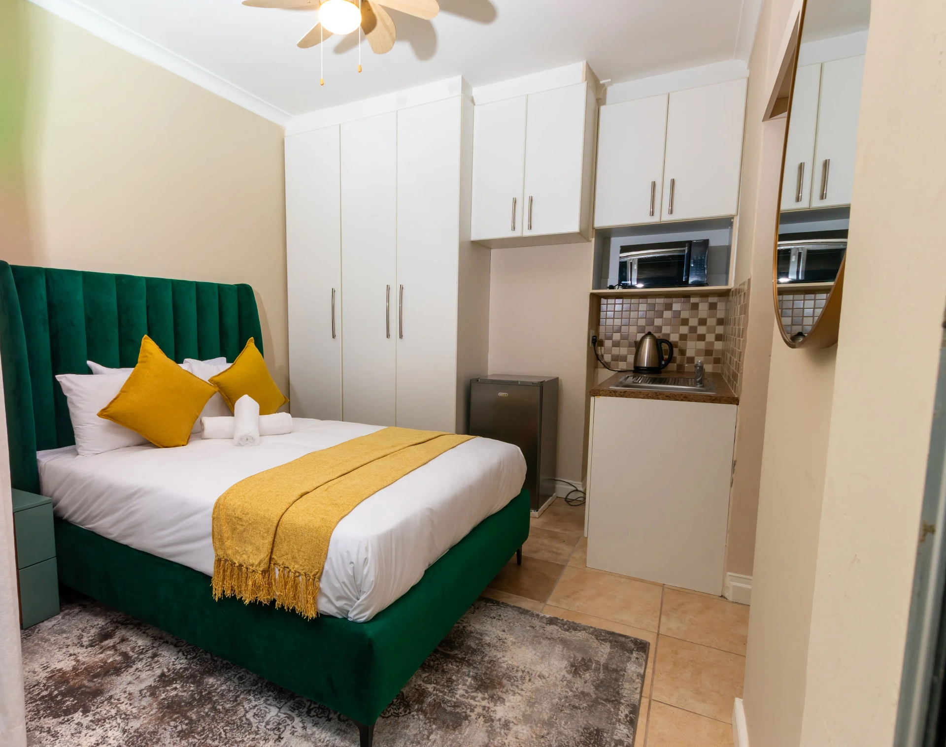 The Aurora Room — bedroom and private kitchenette