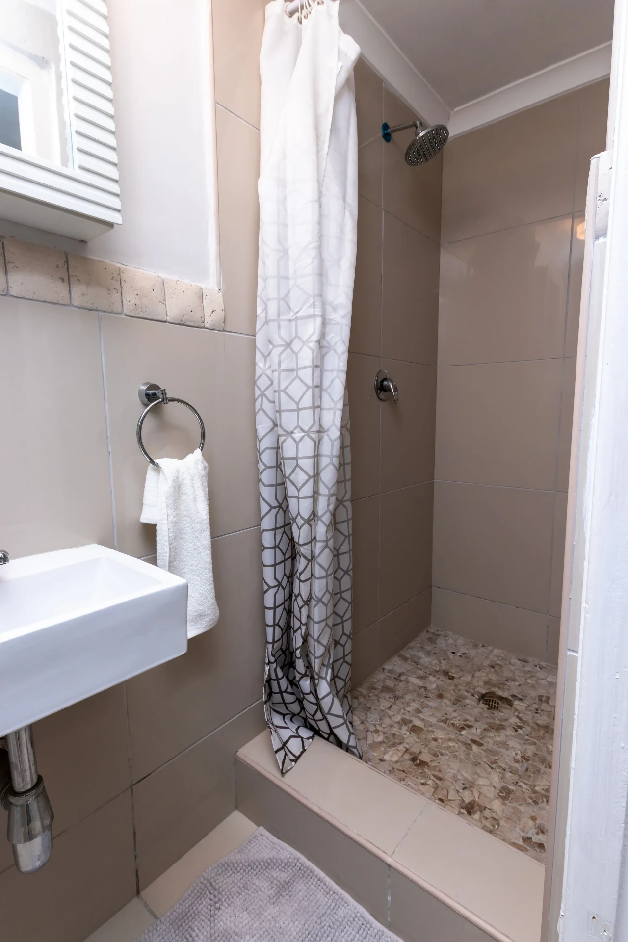 The Signature Room — walk-in shower and basin